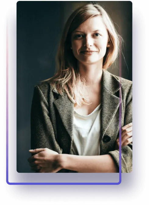 Woman with crossed arms smiling, dressed in business-casual attire, purple gradient frame.