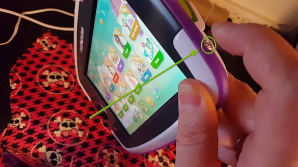 LeapFrog LeapPad Ultimate with the power button highlighted.