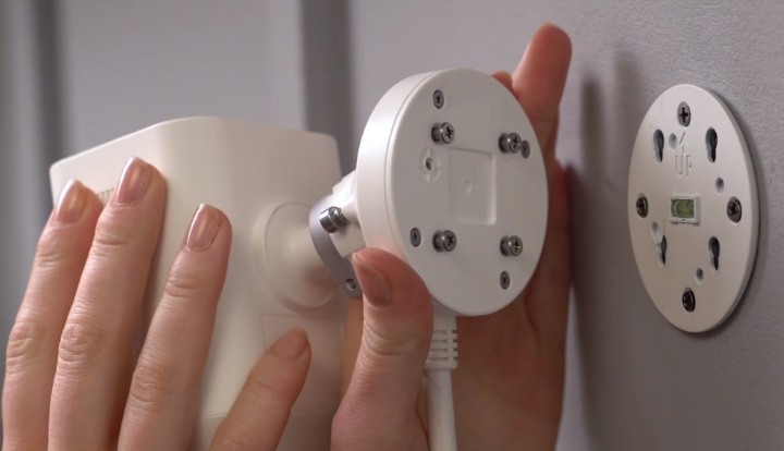 Attaching the camera to the installed mounting bracket.