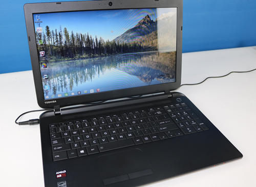 Brand new laptop out of its retail packaging.