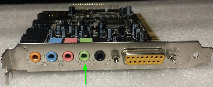 A soundcard showing the light green speaker jack