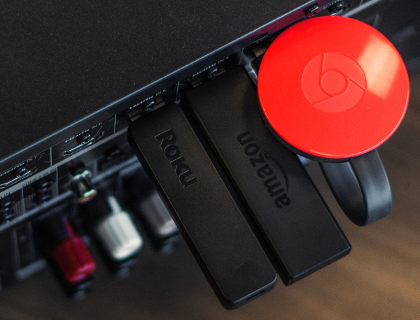 Media player sticks connected to AV Receiver.