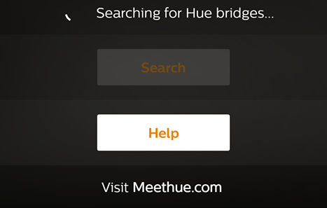 Philips Hue app with Searching for Hue bridges message across the top.