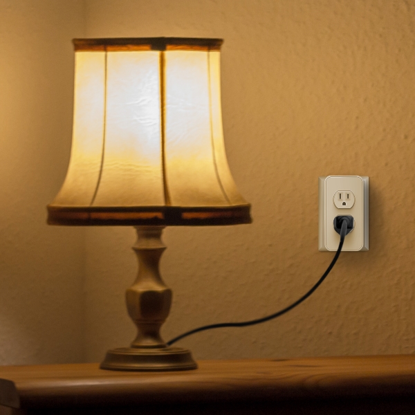 Turned on lamp plugged into power outlet.