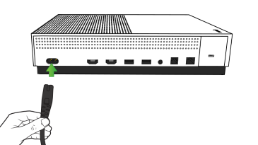 Power cable being plugged into console.