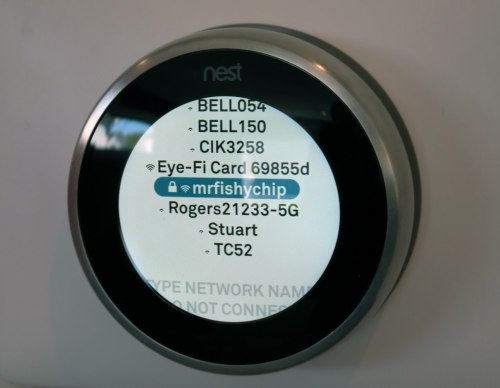 Nest thermostat with network name highlighted