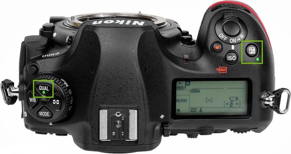 Top of camera with Qual and Plus Minus keys highlighted.