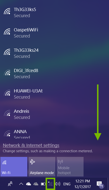 Wi-Fi icon highlighted in Windows 10 system tray and scroll direction annotated in Wi-Fi network list.
