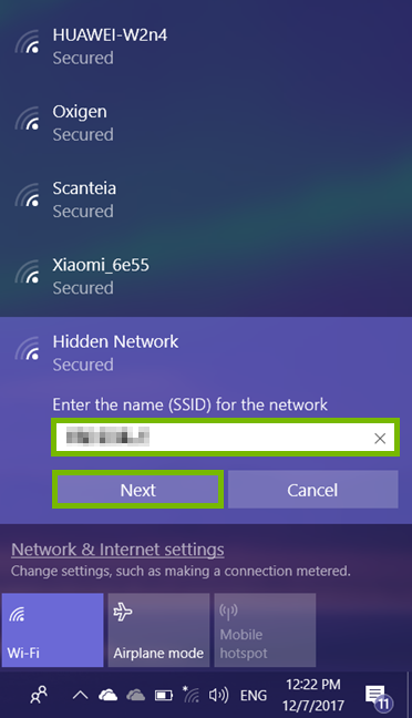 Wi-Fi network entry field and Next option highlighted in Wi-Fi network list.