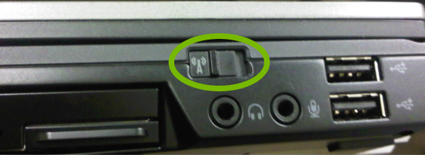 Wi-Fi radio switch highlighted on side of laptop.