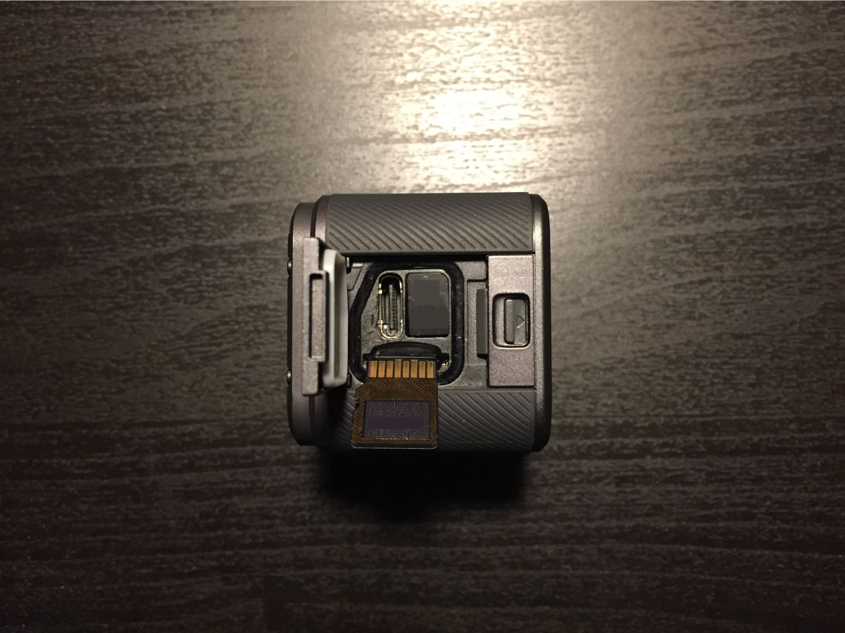 microSD card being inserted into a GoPro.