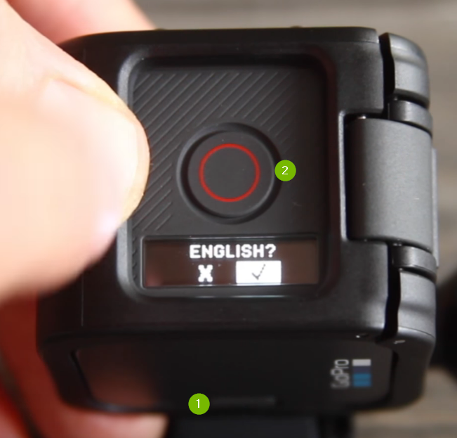 GoPro camera menu with English selected. Shutter button highlighed above and Menu button highlighted below.