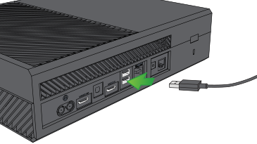 Charge cable being plugged into the Xbox One.