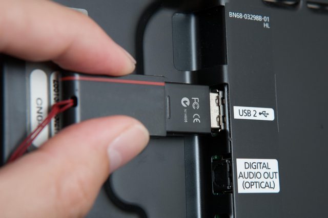 USB drive being inserted into TV