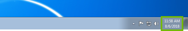 Windows 7 task bar with date and time highlighted.