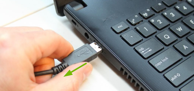 USB device being unplugged from USB port.