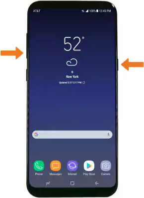 Smartphone with Power and Volume down buttons held down.