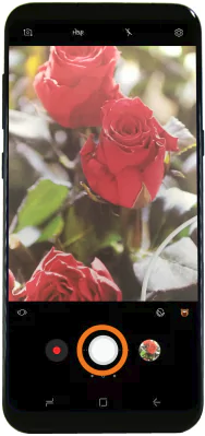 Camera app with shutter button highlighted.