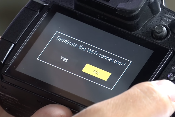 Wi-Fi connection termination prompt on camera screen.
