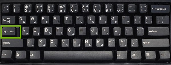 Desktop Keyboard with caps lock key highlighted.