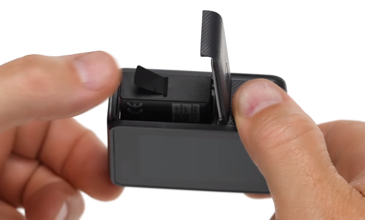 Inserting battery into camera