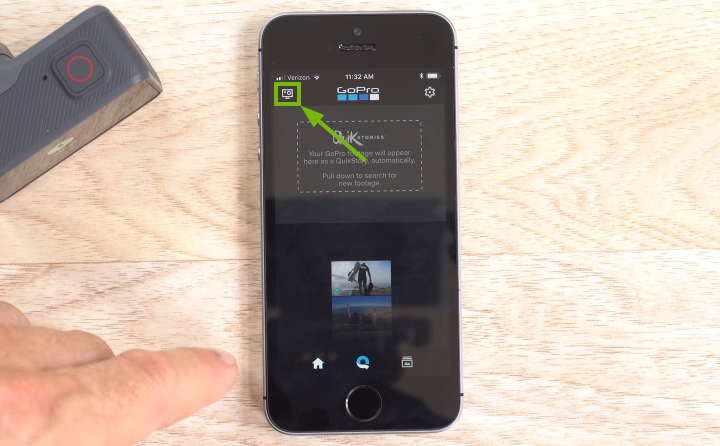 GoPro app with the camera icon highlighted in the upper-left corner of the smartphone screen.