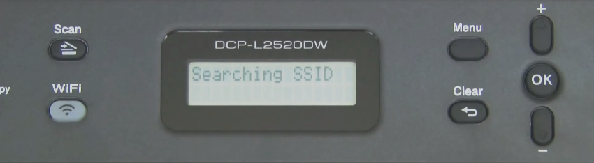 Brother printer control panel displaying it searching for available Wi-Fi networks.