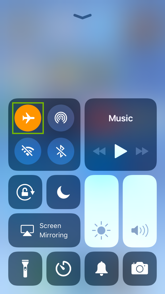 iPhone control center highlighting the airplane mode icon being engaged.