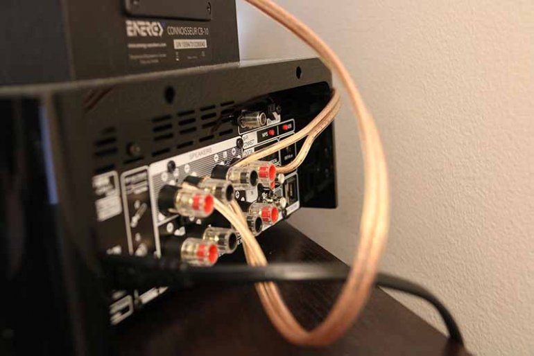 Speaker wire connections on the rear of an AV receiver.