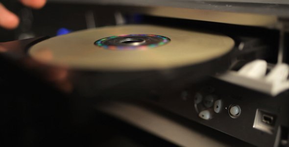 Inserting a disc into a CD or DVD tray. Illustration.
