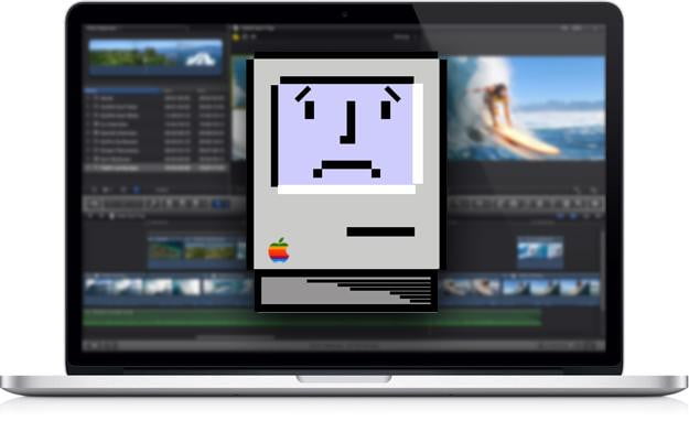 Stock photo of an Apple Macbook displaying the sad mac logo.