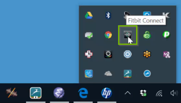 Windows 10 system tray highlighting the FitBit app icon.