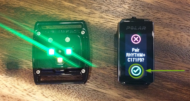 Polar watch detecting the heart rate sensor highlighting the green check mark.