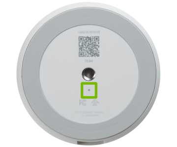 Reset button location highlighted on bottom of camera