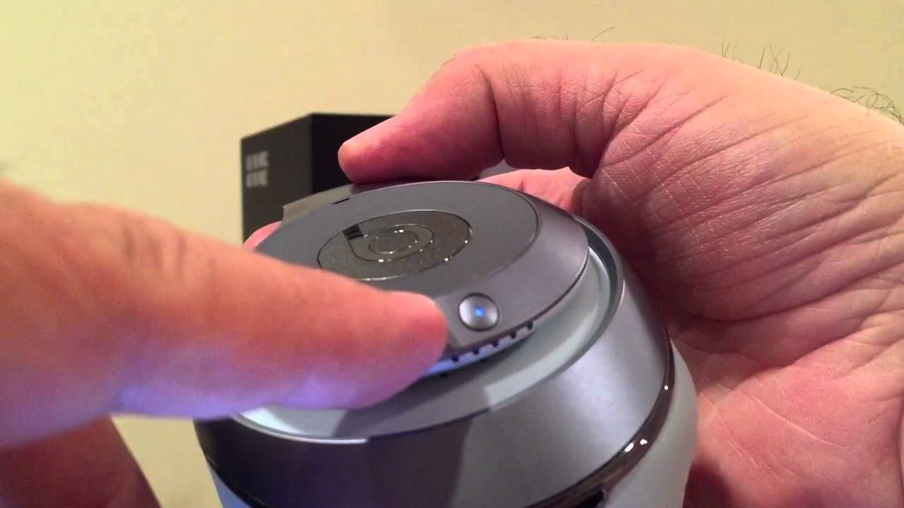 Wireless headphones being placed into pairing mode.