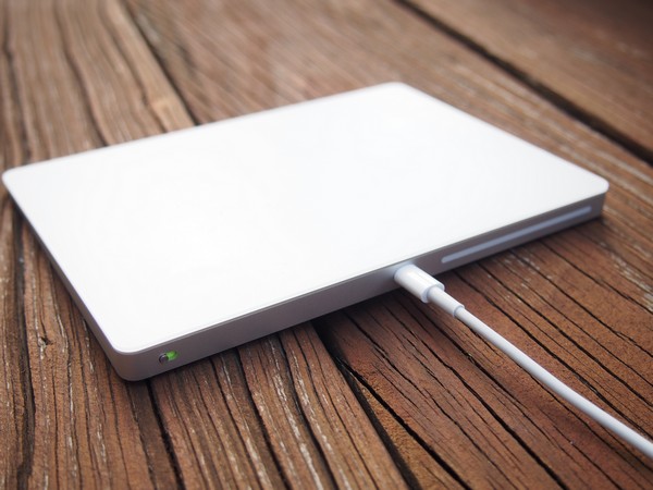 Magic Trackpad plugged in via supplied Lightning to USB cable.
