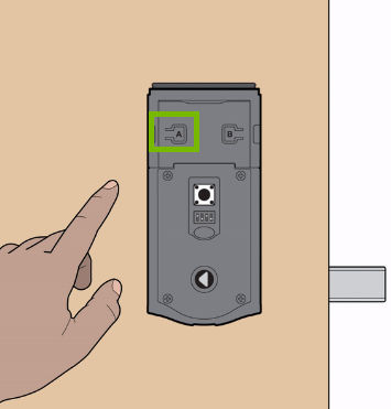 Reset button location highlighted on door lock