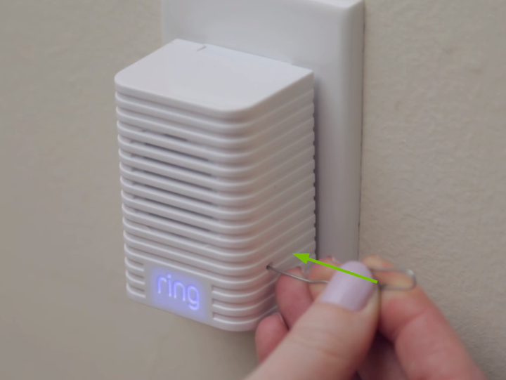 Paperclip inserted in pinhole