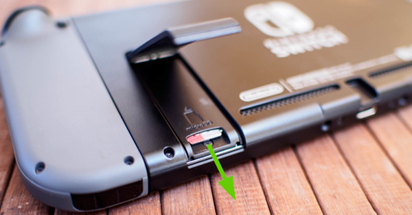 Switch showing how to pull the microSD card out.