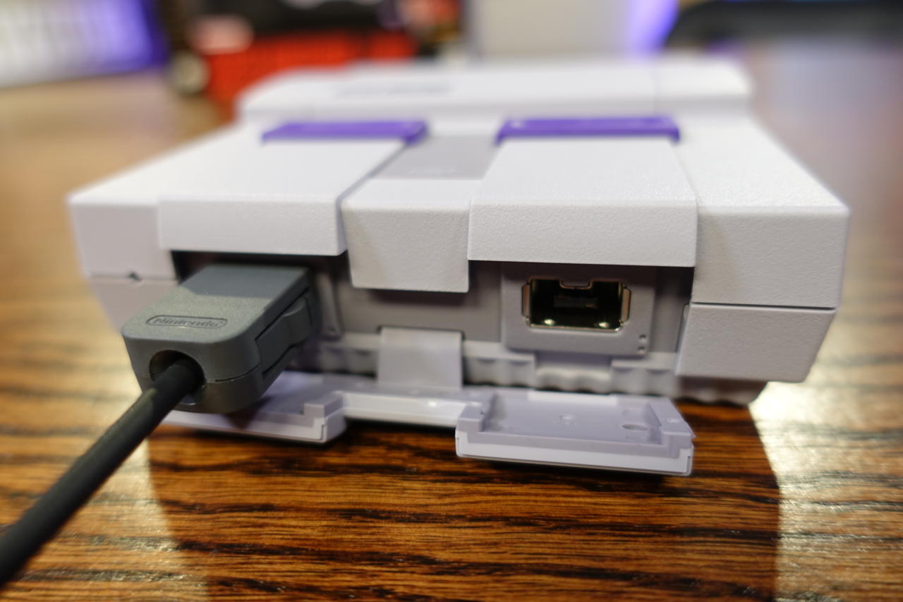 Photo of the SNES Classic Edition with a controller connected to controller port 1.