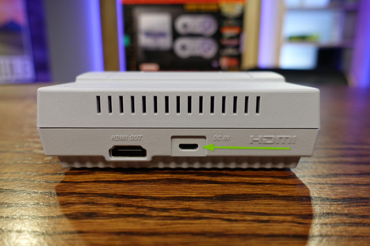Photo of the SNES Classic Edition highlighting the micro USB power connector input on the rear.
