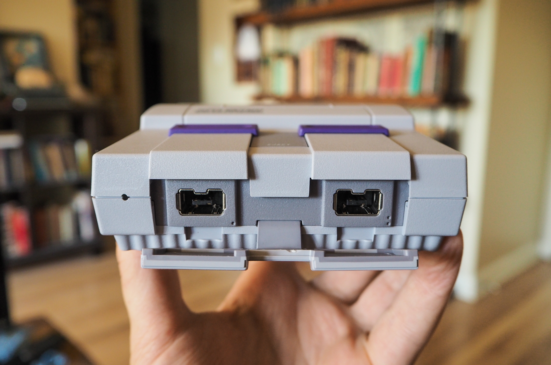 Photo of the SNES Classic Edition highlighting the front controller port cover after being opened.