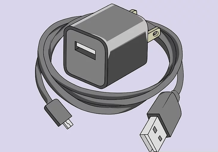 Image of a USB cable and USB wall charger being inspected for defects