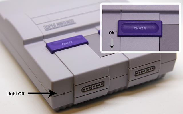 Picture of a Super Nintendo Classic Edition with the power switch in the off position, and the power LED off