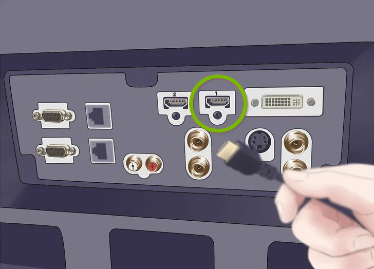 Image of an HDMI cable being inserted into the HDMI port on the back of a television