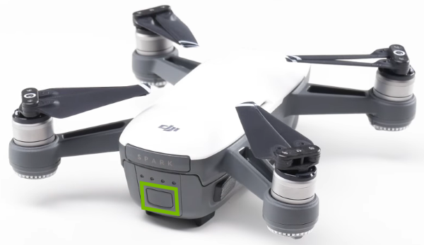 Power button highlighted on rear of drone.