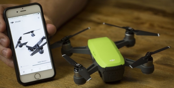 Mobile device next to Spark drone.