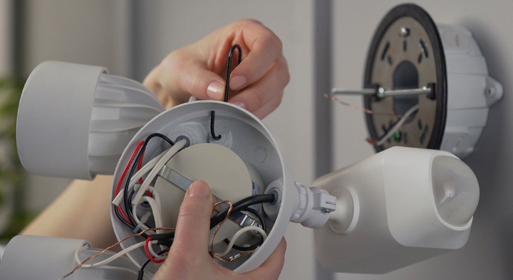 Using the hook to hang the camera during installation.