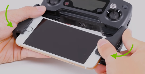 Arrows pointing how to fold the clamps.