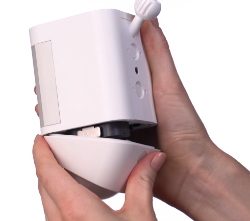 Battery compartment door being closed.